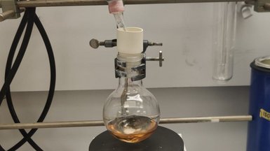 Round-bottom flask with sample