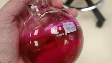 Round bottom flask with strongly colored sample